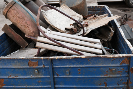 Dumpster full of scrap metal in a recycling center, close up