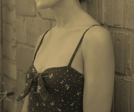 Woman standing on the sea and posing for a photo on vacationの写真素材