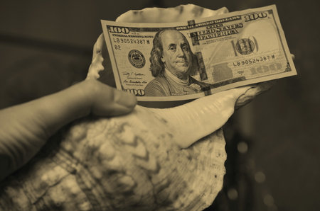 a person dresses up a Christmas tree for the New Year, balls are visible, other objects for the holidayの写真素材