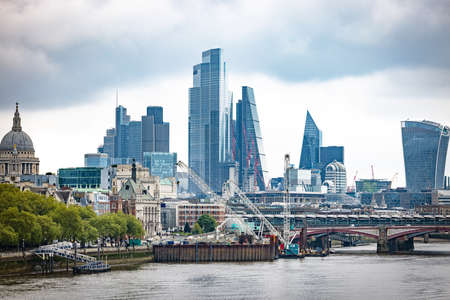 A bridge over water with a city in the backgroundの写真素材