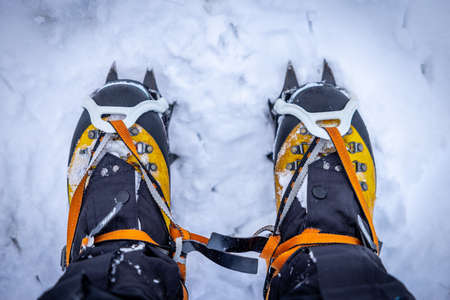 Winter hiking boots with crampons