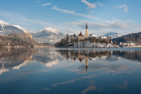 View on lake Bled with small island with church and castle on rock in Slovenia, Europe.の写真素材