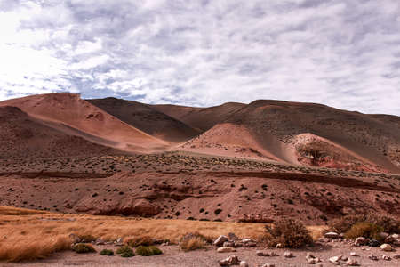 Desertic landscape with mountains and geological formations from Argentinaの写真素材