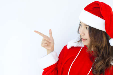 A Beautiful Asian santa woman in red cloth with copyspace  の写真素材