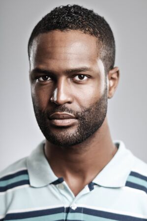An African American man in his 20's with a blank expression.の写真素材