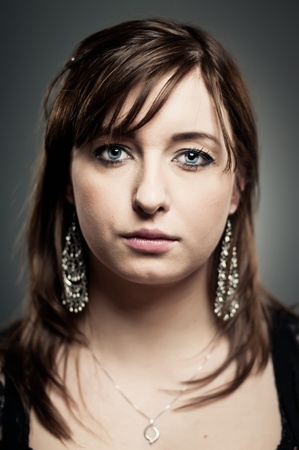 A Caucasian woman in her 20's with a blank expression.の写真素材