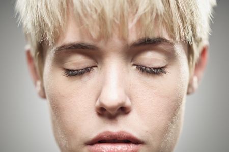 A beautiful young Caucasian woman in her twenties with her eyes closed.の写真素材