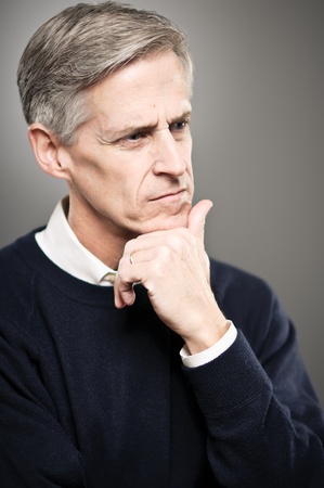 A mature man in his 50's with his eyes close.の写真素材