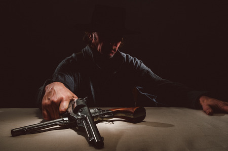 Gunslinger in the shadows  の写真素材