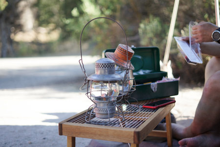 Kerosene lamp on a picnic in the shade of trees.の写真素材