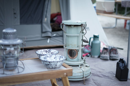 Camping stove in a tent. Camping equipment on the ground.の写真素材