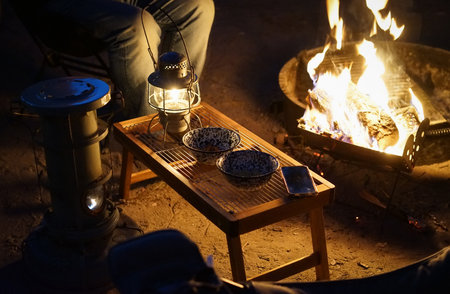 Camping by the fire in the evening. Camping concept.の写真素材