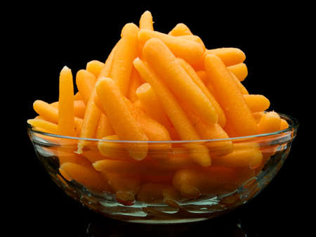 Close-up of a bowl of organic baby carrotsの写真素材