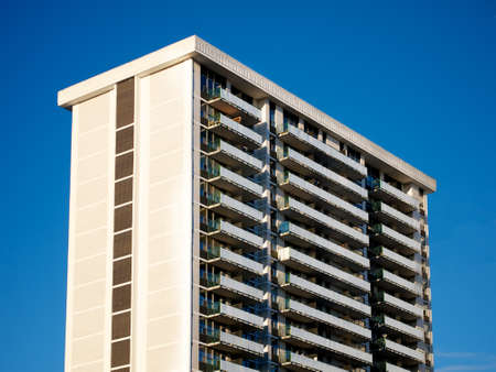 An 80s apartment building on the blue-sky day.の写真素材
