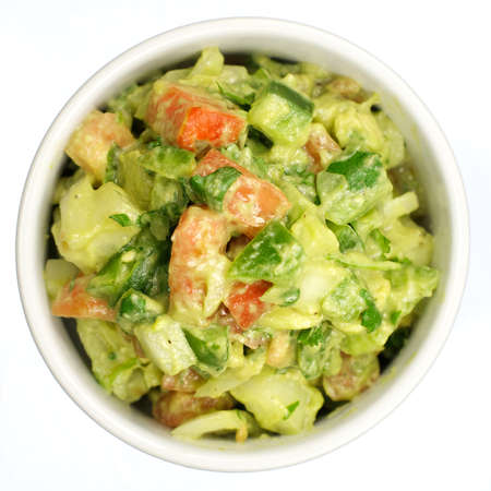 Closeup of a fresh guacamole isolated on whiteの写真素材