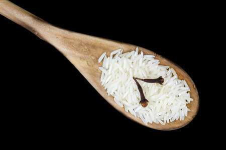 Closeup overview of Basmati rice in a wooden spoonの写真素材