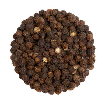Closeup overview of curry powder isolated on whiteの写真素材
