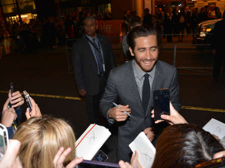 TORONTO - SEPTEMBER 6: Actor Jake Gyllenhaal signs autographs at the Toronto International Film Festival for his new film Prisoners on September 6, 2013.のeditorial素材