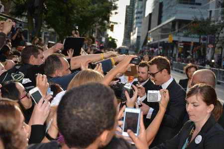TORONTO - SEPTEMBER 6: Actor Michael Fassbender signs autograph at the Toronto International Film Festival for his new film 12 Years a Slave on September 6, 2013.のeditorial素材