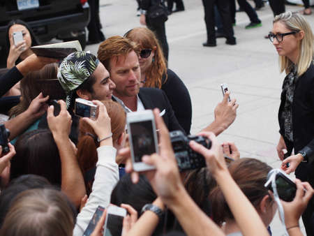 TORONTO - SEPTEMBER 9: Actor Ewan McGregor takes a selfie with fans at the Toronto International Film Festival for his new film August: Osage County on September 9, 2013.のeditorial素材