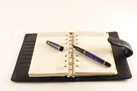 Leather agenda with a fountain penの写真素材