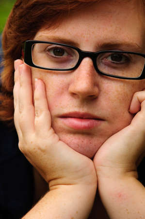 Beautiful young woman with glasses on a summers day