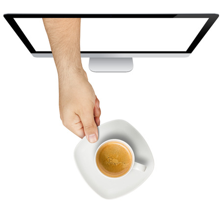 Topview of male hand serving cup of coffee hand coming out from computer screen isolated on whiteの写真素材