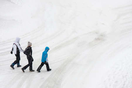 Andalo, Italy - March 2016: People walking in the snow in Andalo, Italyのeditorial素材