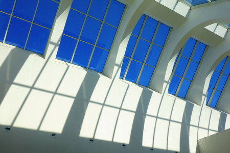 High Glass wall detail architecture in a sunny day indoor