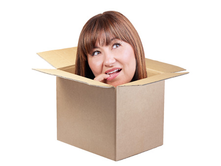 Brunette woman thinking out of the box isolated