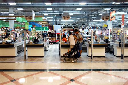 Customers at supermarket making check outのeditorial素材