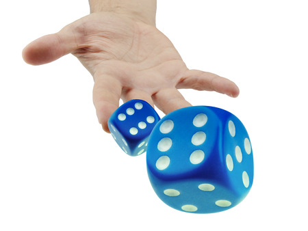 Throwing or rolling dice closeup isolated