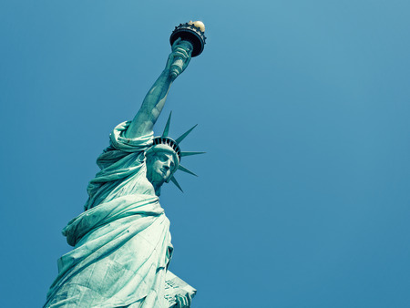 Statue of liberty closeup against clear blue skyの写真素材