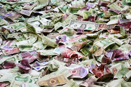 Bunch of chinese banknotes and one dollar billの写真素材