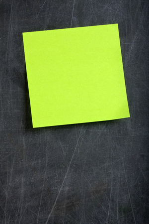 Blank Green glued on dirty blackboard or chalkboardの写真素材