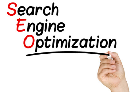 Hand Writing Search Engine Optimization on Whiteboard isolatedの写真素材