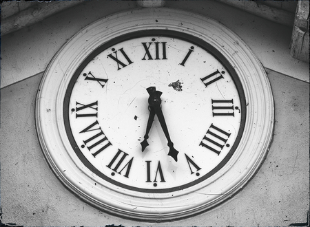 Old clock on the wall monochromaticの写真素材