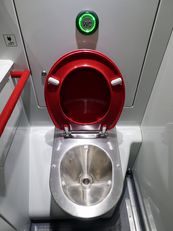 Modern red toilet train or airplaneの写真素材
