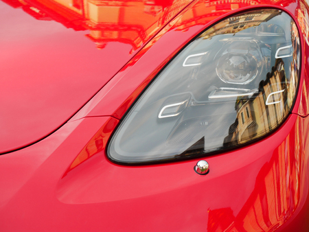 headlight red sports luxury car close up