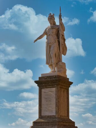 Statue of Liberty in San Marino against sky with cloudsの写真素材