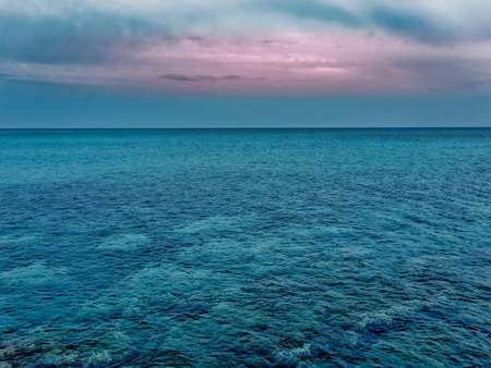 Seascape horizon blue water at duskの写真素材