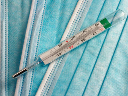 Face Medical mask and thermometer for measuring temperature