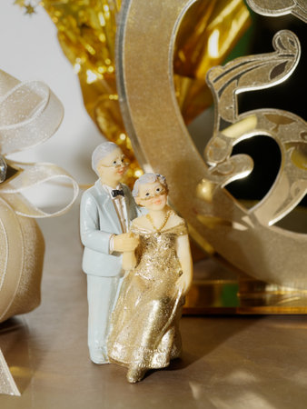 elder couple statue golden weddingの写真素材