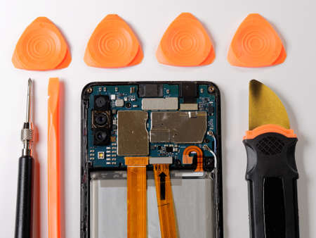 Tools for Repairing Faulty Mobile Phone. Electronic Smartphone Technology Service