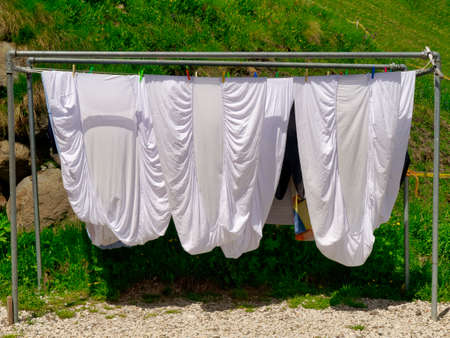 clothes drying on a clothesline in summerの写真素材