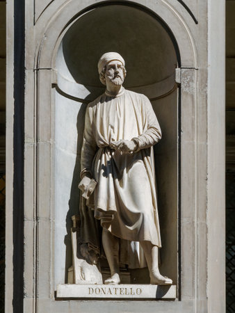 The statue of Donatello outside the Uffizi colonnade in Florence.