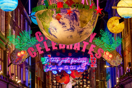 London, UK - December 2022: xmas or christmas lights at carnaby street. Colorful decorations on the...