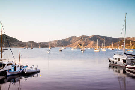 Anchored yachts in Grikos Bay, Patmos - Greece, August 2018のeditorial素材