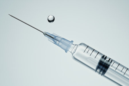 A close-up image of a medical syringe with a droplet of liquid resting on a smooth surface. This image highlights the precision and detail of medical instruments used in healthcare. ai generated.の素材