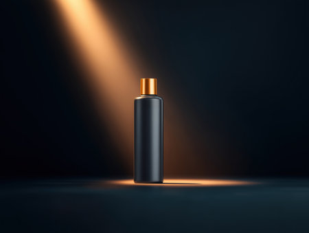 A sleek shampoo bottle with a modern design illuminated by a spotlight. The dark background enhances the product's luxurious appearance, making it ideal for advertorials and promotional materials.ai generated.の素材